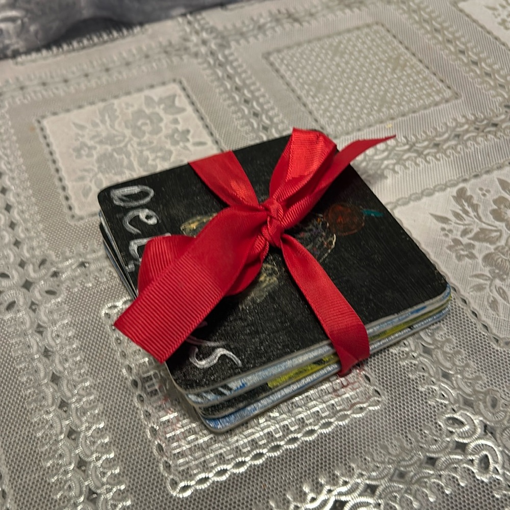 Coasters four black light blue design four to put drinks on !